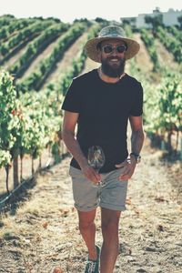 Portrait of young man wearing sunglasses standing outdoors