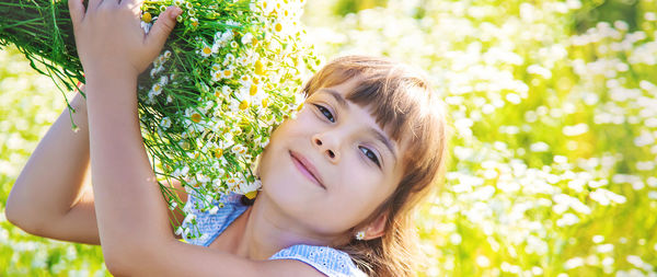 Girl holding flower bouquet