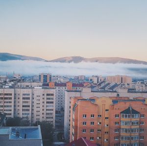 Cityscape against sky during sunset