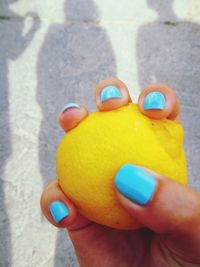 Close-up of hand holding multi colored candies