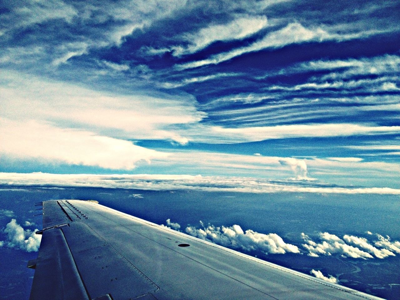 transportation, snow, winter, sky, airplane, cold temperature, flying, mode of transport, air vehicle, cloud - sky, aircraft wing, landscape, beauty in nature, nature, scenics, weather, white color, blue, season, cloud