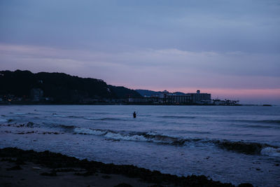 Scenic view of sea against sky at sunset