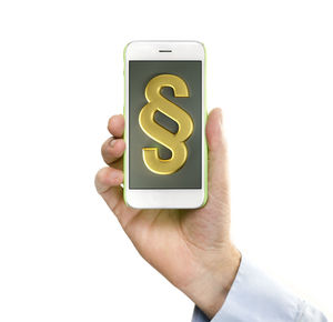 Cropped hand holding mobile phone with paragraph icon on display against white background