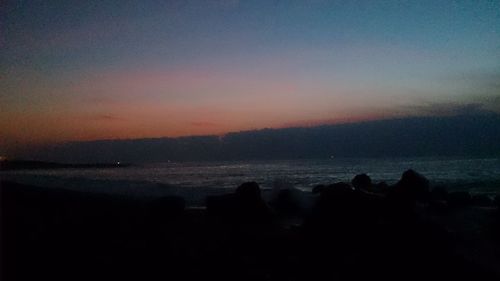 Scenic view of sea against sky at sunset