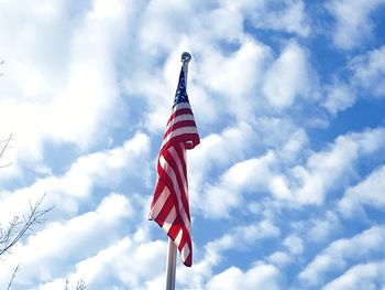 Low angle view of flag against sky