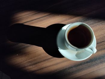 High angle view of coffee cup on table