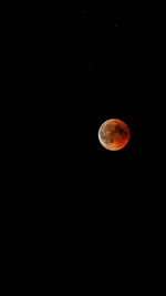 Low angle view of moon against sky at night