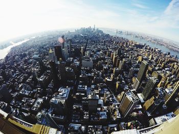 High angle view of modern buildings in city against sky