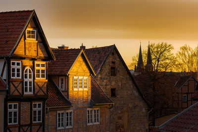 Buildings against sky during sunset