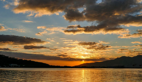 Scenic view of lake against sky during sunset