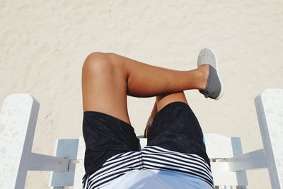 Low section of woman sitting on floor