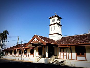 Low angle view of church against blue sky