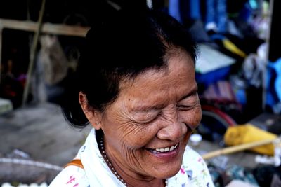 Close-up of smiling woman at market