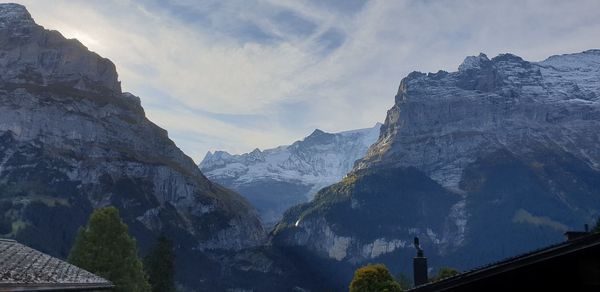 Panoramic view of snowcapped mountains against sky