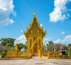 View of temple building against cloudy sky