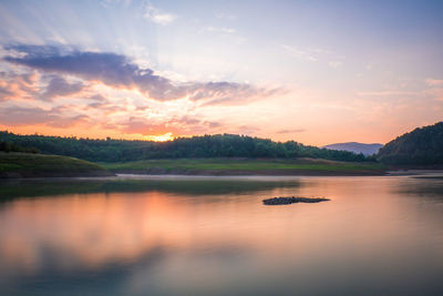 Scenic view of lake against sky during sunset