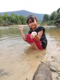 Portrait of smiling kid in lake