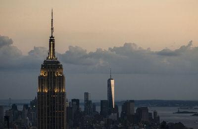 City skyline against cloudy sky