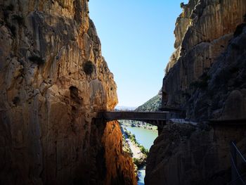 Arch bridge over river against sky