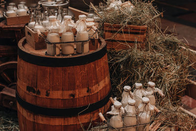 Milk bottles mockups on the hay. autumn farmmarket. rustic style. healthy products. thanksgiving