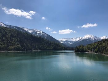 Scenic view of lake and mountains against sky