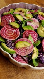 High angle view of chopped fruits in plate on table