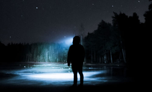 Full length of silhouette man against sky at night