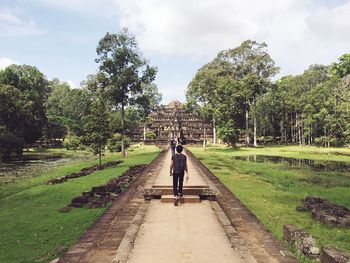 Rear view of woman walking in park