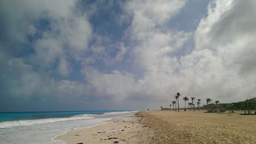 Scenic view of sea against cloudy sky