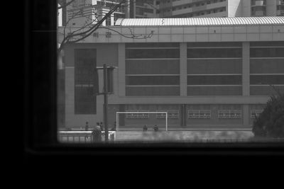 Woman standing in front of building