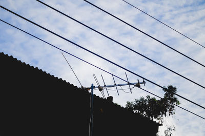 Low angle view of cables against sky