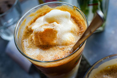 High angle view of coffee in glass on table