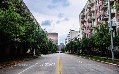 Street amidst buildings against sky