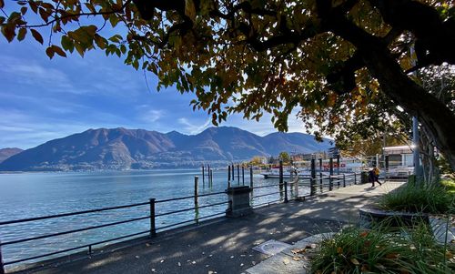 Scenic view of sea and mountains against sky