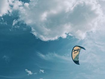 Low angle view of kite flying against sky