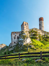 Old ruin building against blue sky