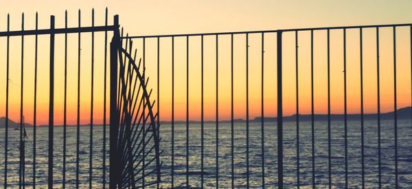 Scenic view of sea against orange sky