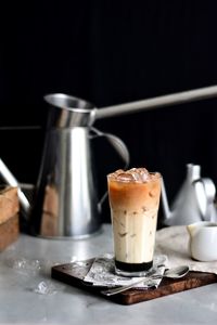 Teh c peng in glass on table