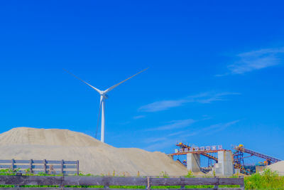 Low angle view of bridge against clear blue sky