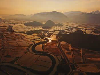 Scenic view of landscape against sky during sunset