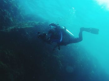 Person scuba diving undersea