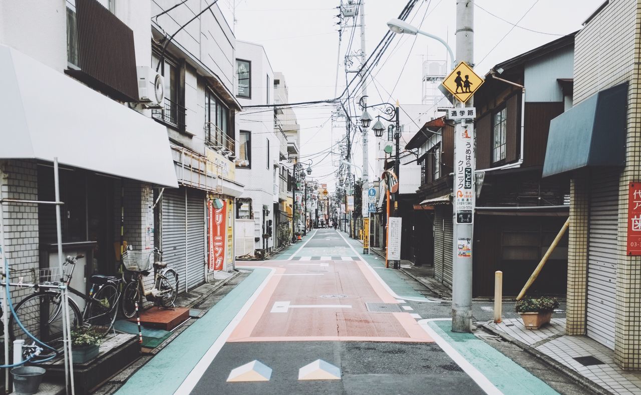 building exterior, architecture, built structure, the way forward, residential building, residential structure, diminishing perspective, city, building, power line, vanishing point, day, outdoors, alley, cable, no people, narrow, sky, residential district, empty, city life, town, city street