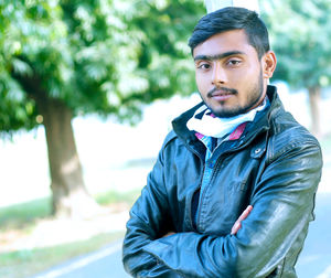 Portrait of young man standing outdoors