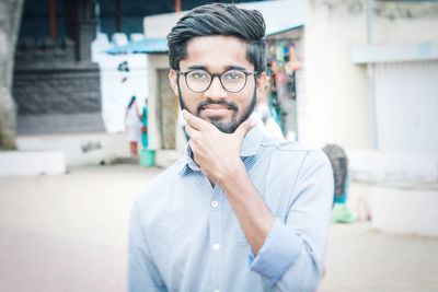 Portrait of young man standing outdoors