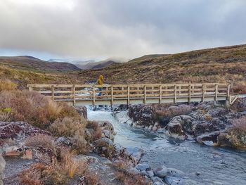 Scenic view of bridge over river against sky