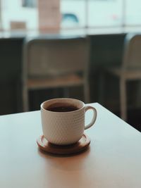 Close-up of coffee cup on table