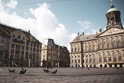 View of buildings against cloudy sky