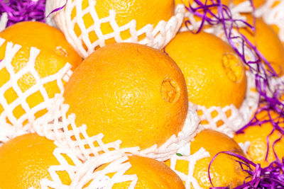 High angle view of orange fruit in basket