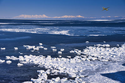 Scenic view of frozen sea against sky