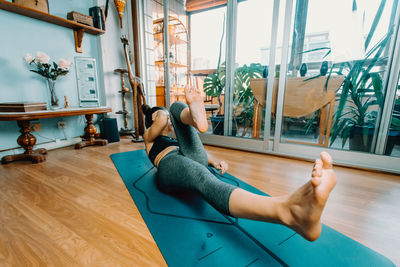 Low section of woman exercising in gym